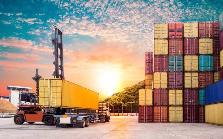 Shipping containers at a logistics yard at sunset